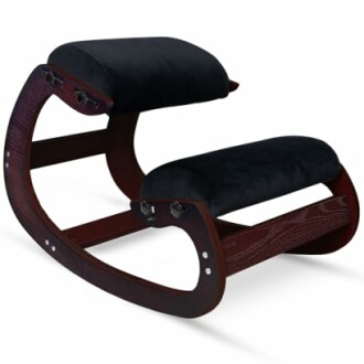 Ergonomic kneeling chair with dark wooden frame and black cushions.