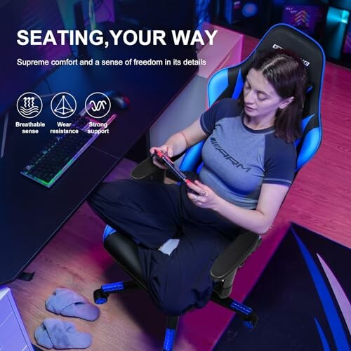 Person comfortably seated in a GTRACING gaming chair with a controller.