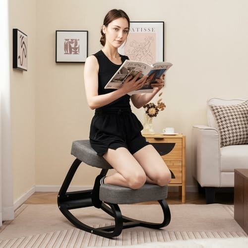 Woman reading a magazine on a kneeling chair in a living room.